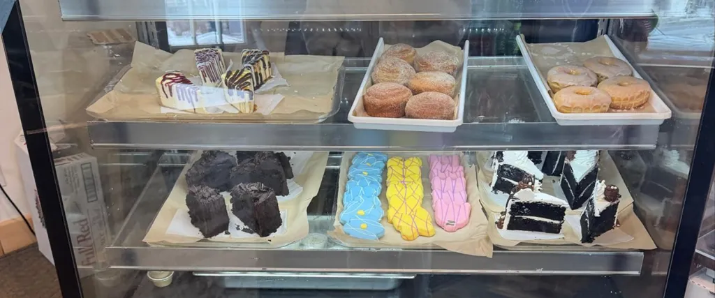 Fresh baked goods arranged in a pastry case