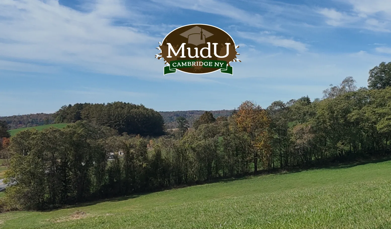 Mud U logo over a rural Washington County landscape