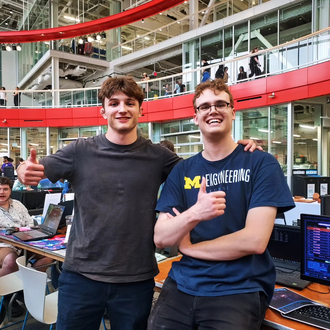 Young builders presenting technology at a student showcase