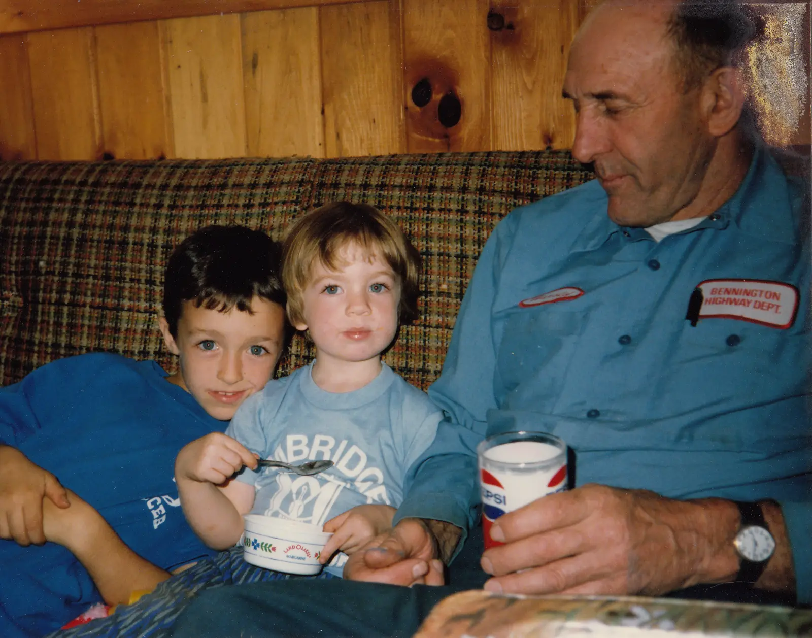 Harold Prouty sitting with two of his grandchildren